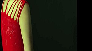Запањујућа жена са шармантним грудима заводи вас у провокативну позу док носи заводљиву црвену хаљину